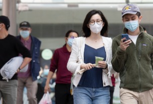 Hong Kong won’t reopen foreign travel until outbreak eases, Lam says