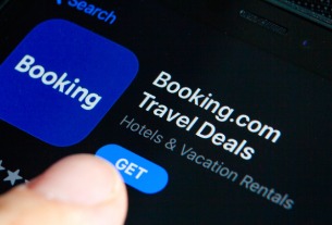 Booking says travel travails cut into July growth, bullish for long term