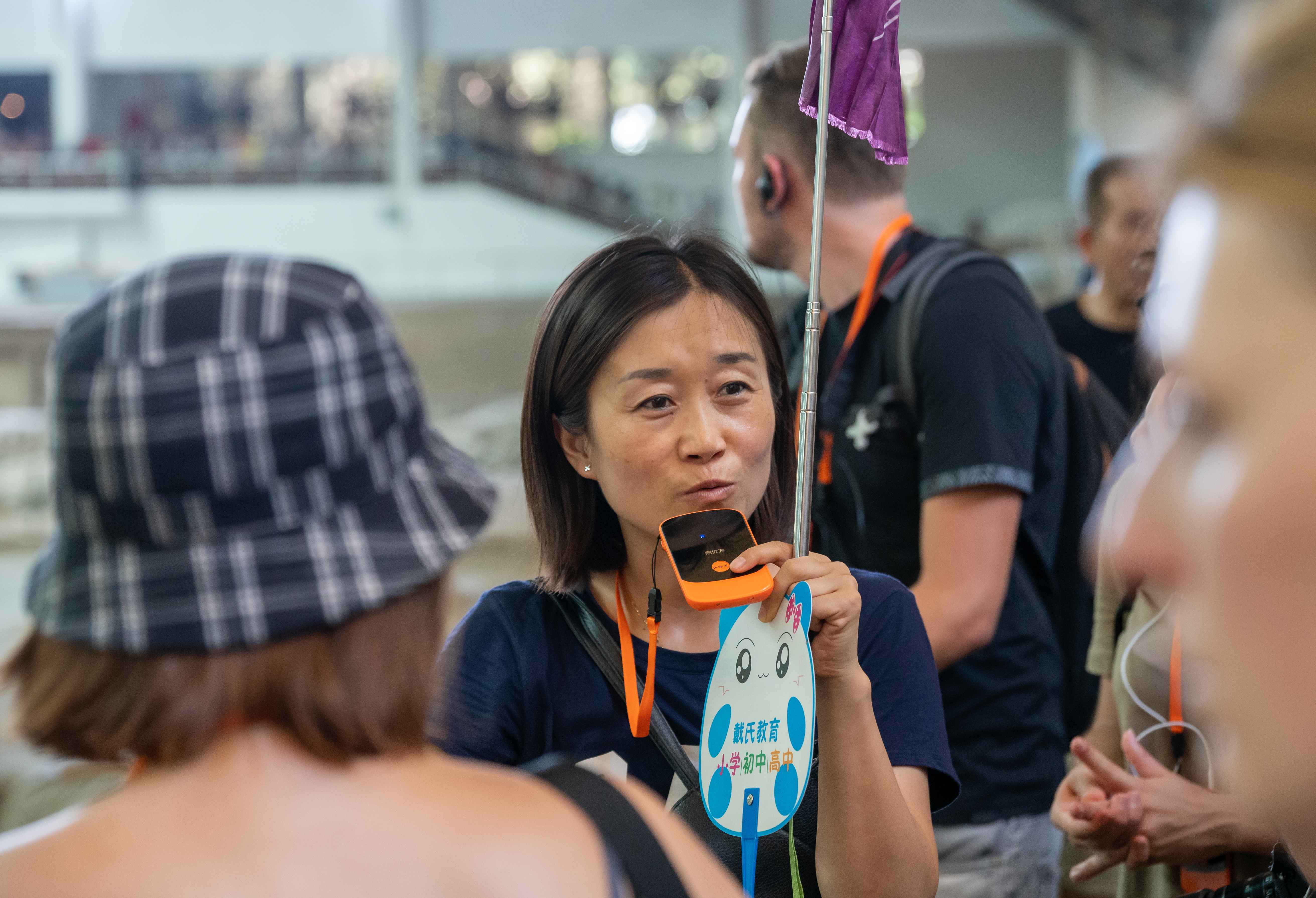 Chinese tour guides armed with translation devices disrupt inbound travel agencies with lower prices